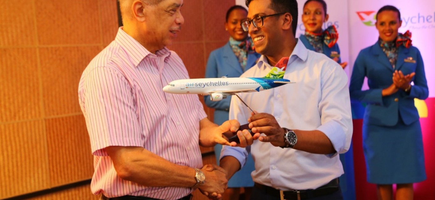 President Michel receives a model aircraft of ‘Amirantes’ from Air Seychelles’ Chief Executive Officer, Manoj Papa
